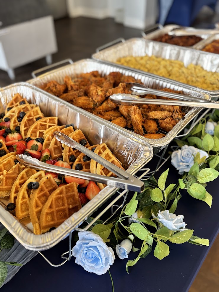 Chicken and waffles brunch buffet styled with blue roses